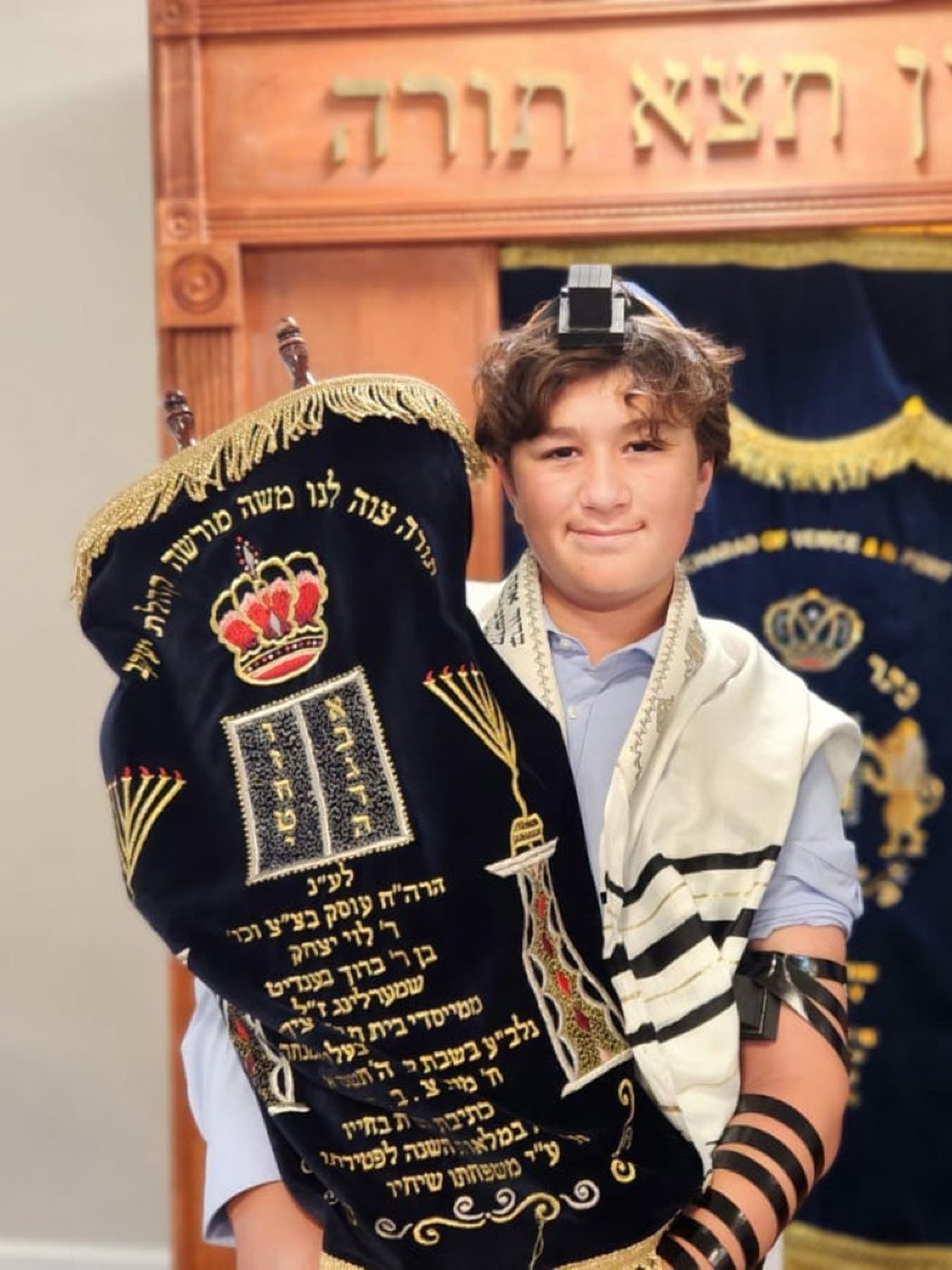 A boy reading from the Torah at Chabad of Venice