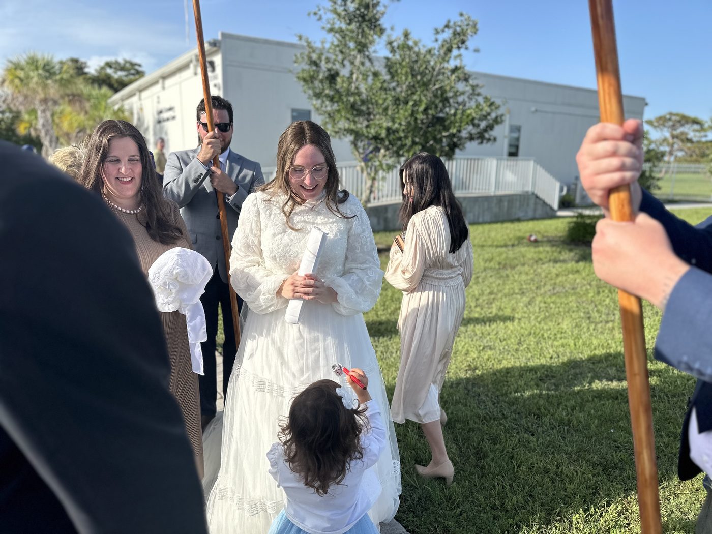 Rivka with guests outside after the ceremony