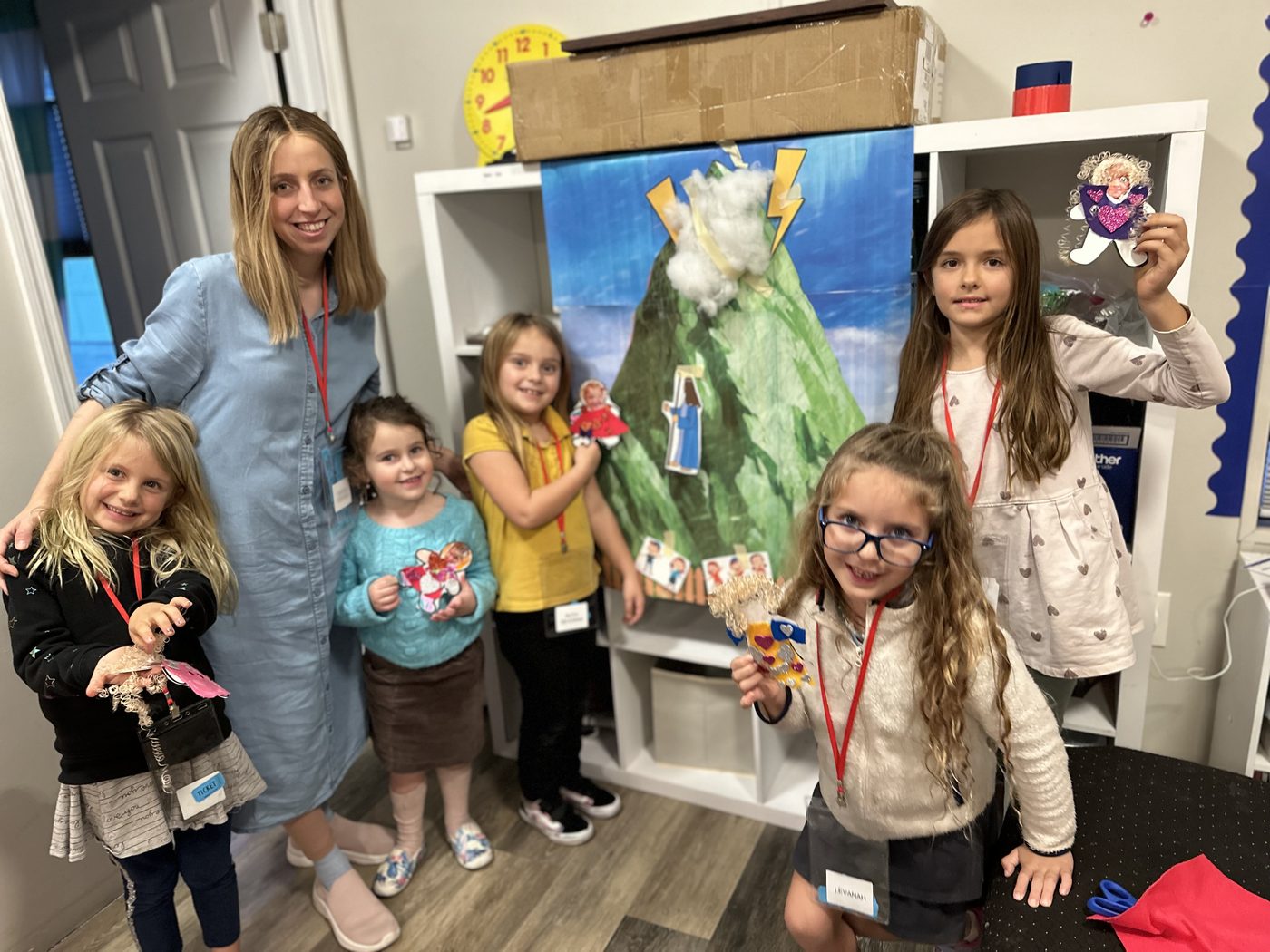 A Hebrew School class at Chabad of Venice, children holding up the crafts they made with their teacher