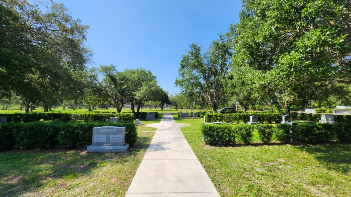 A walking path running through the Jerusalem Gardens section beneath oak trees
