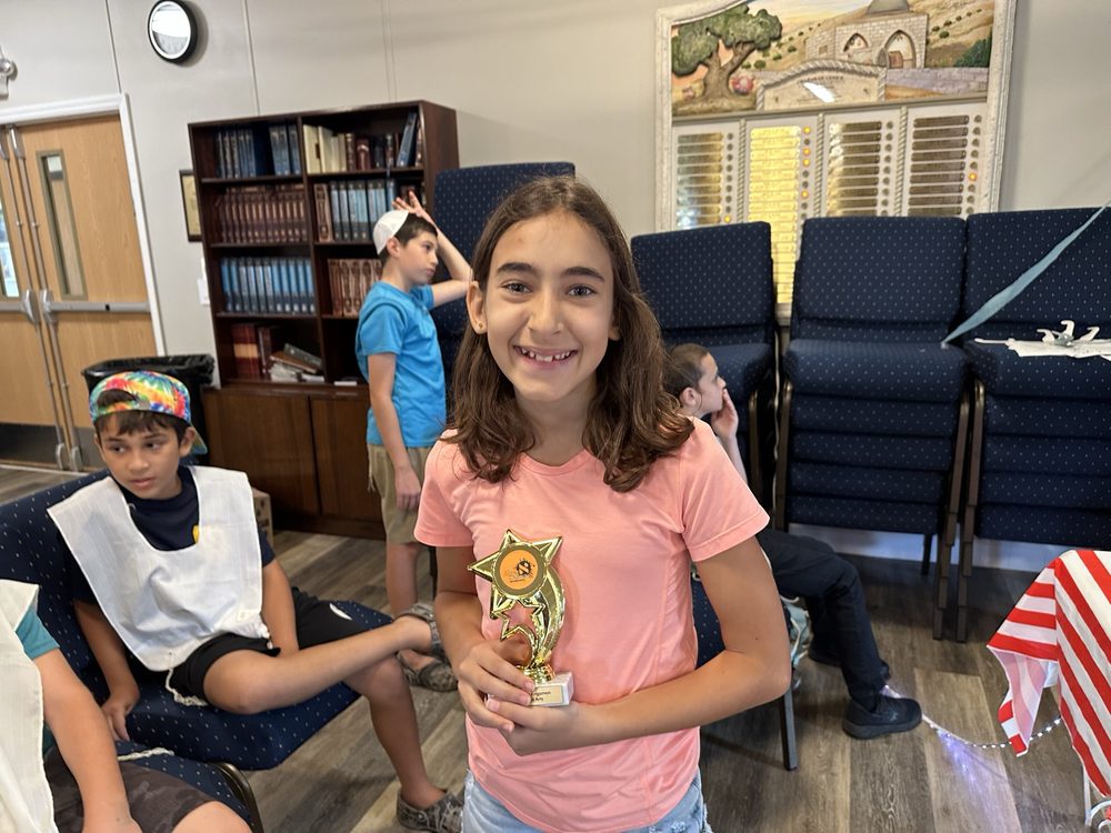 A CTeen member with a trophy