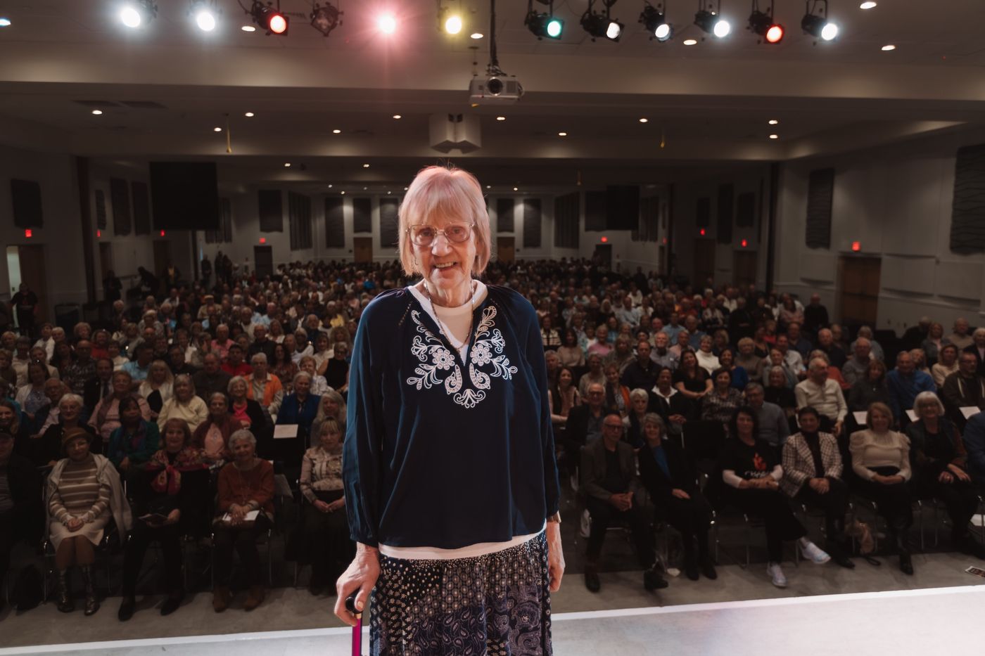 A Holocaust survivor addressing the full hall